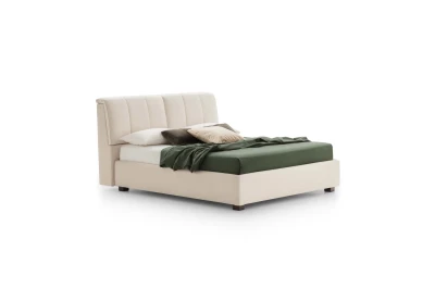 Inside — Bed with a tufted headboard and a built-in storage compartment.