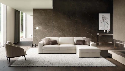 Robert — Sofa with extendable seats, adjustable headrests, and an extendable footrest with raised borders.