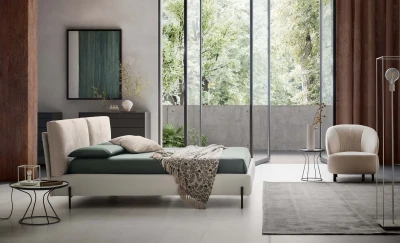 Ischia — Bed with a headboard made of a large, comfortable, and movable cushion.