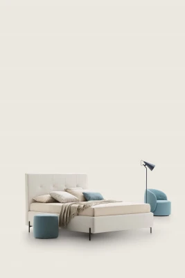 Love — Modern squared bed with light tufting on the headboard and decorative piping.
