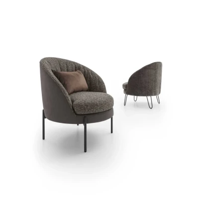 Oyster — Enveloping, rounded armchair with a seashell-inspired design. Fixed or swivel base options available.
