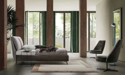 Fold — Bed with a headboard made of large adjustable cushions.
