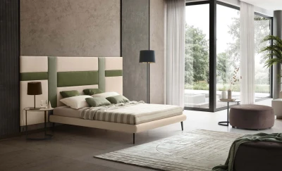 Ground — Contract bed with a headboard made of vertical padded panels.