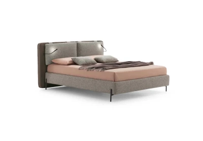 Cortina — Bed with a cushioned headboard wrapping around the structure and a USB port for optional LED lights.