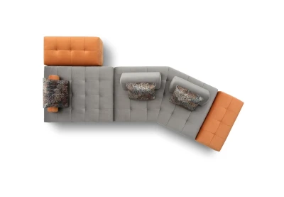 Reed — Quilted modular sofa with low legs and smooth sliding backrests.