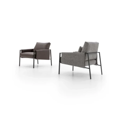 Andy — Armchair with painted metal frame and padded seat, backrest, and armrests. Contemporary industrial design.