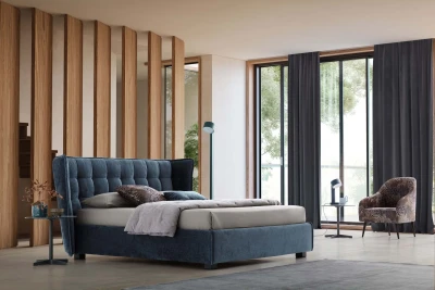 Aspen — Wingback bed with a quilted headboard.
