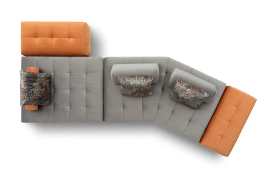 Reed — Quilted modular sofa with low legs and smooth sliding backrests.