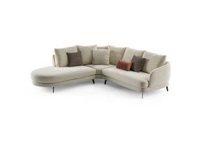 Jand — Sofa with organic shapes, high legs, round end modules, and shaped seats