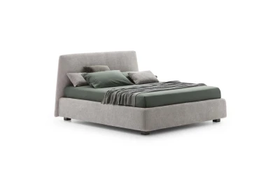 Calvin — Bed with a simple design featuring a softly rounded and smooth upholstered headboard.