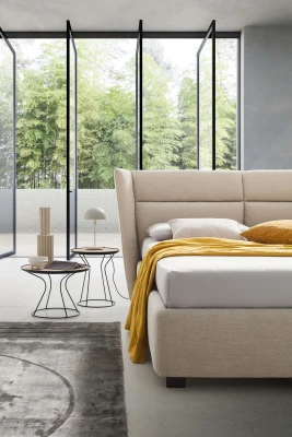 Pasodoble — Elegant wingback bed with wide padded headboard.