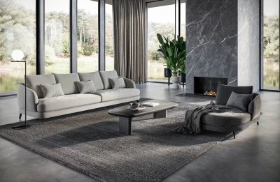 Jand — Sofa with organic shapes, high legs, round end modules, and shaped seats
