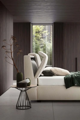 Inside — Bed with a tufted headboard and a built-in storage compartment.
