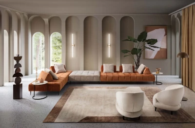 Bowie — Quilted modular sofa with high legs and smooth sliding backrests.