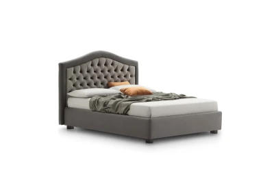 Dama — Classic-style bed with an arched tufted headboard.